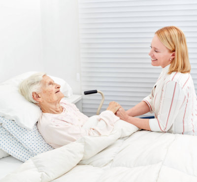 caregiver taking care of her patient