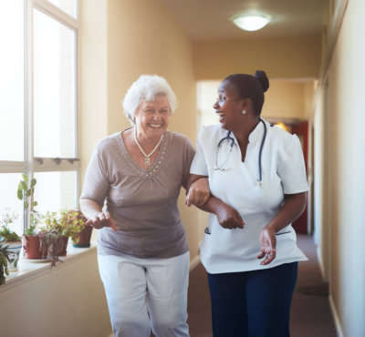 caregiver and a nurse having a conversation
