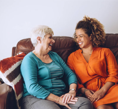 caregiver and a senior woman having a conversation