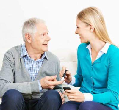 nurse checking her patient blood sugar level
