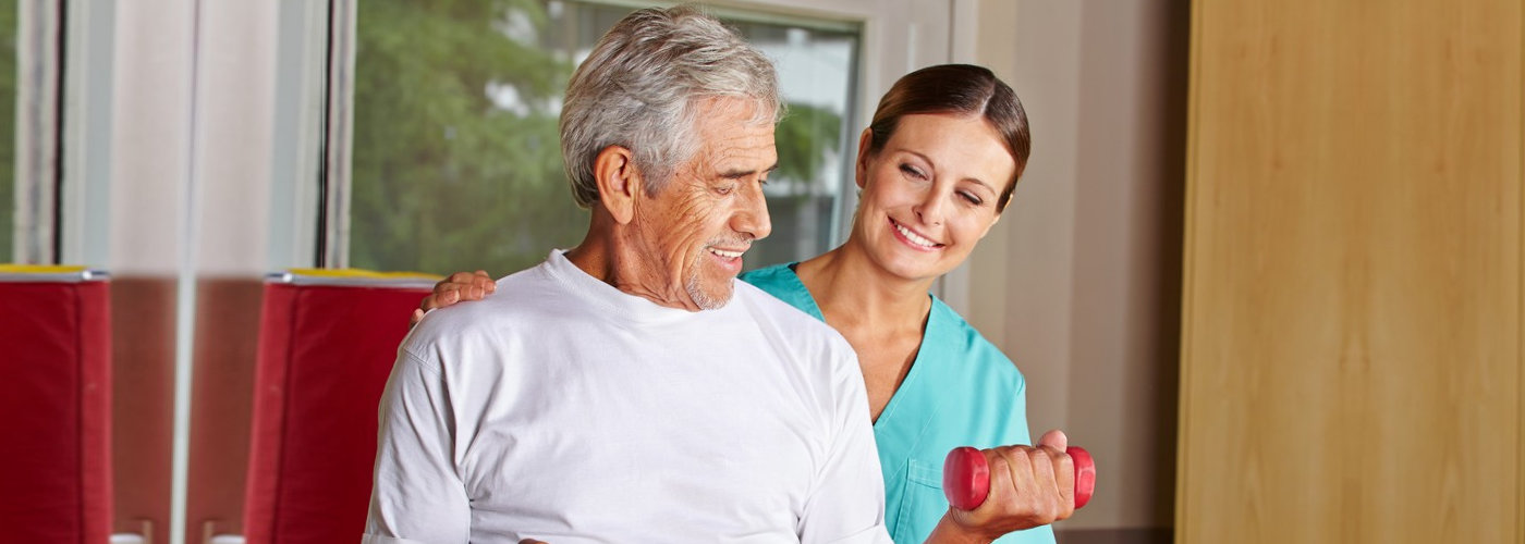 caregiver assisting her patient