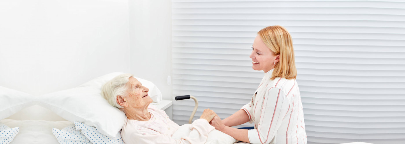 caregiver taking care of her patient
