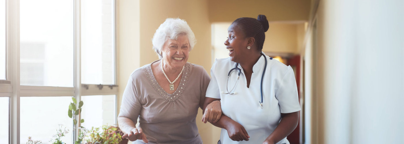 caregiver and a nurse having a conversation