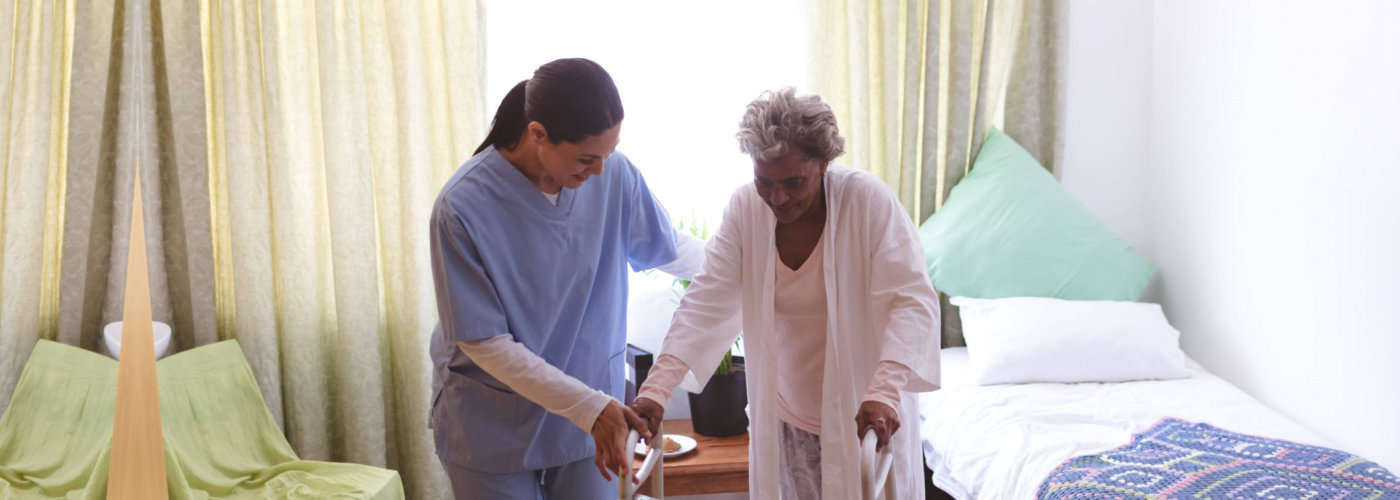 caregiver helping her patient